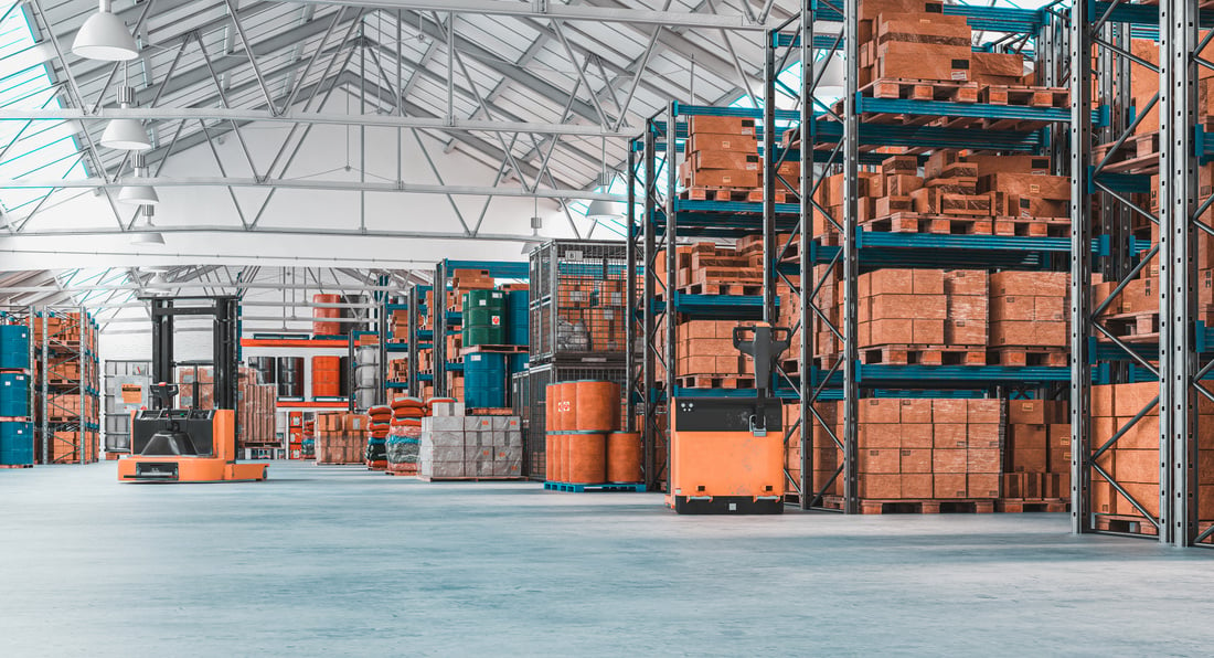 Concrete Storage Warehouse with Pallets and Shelves Full of Goods